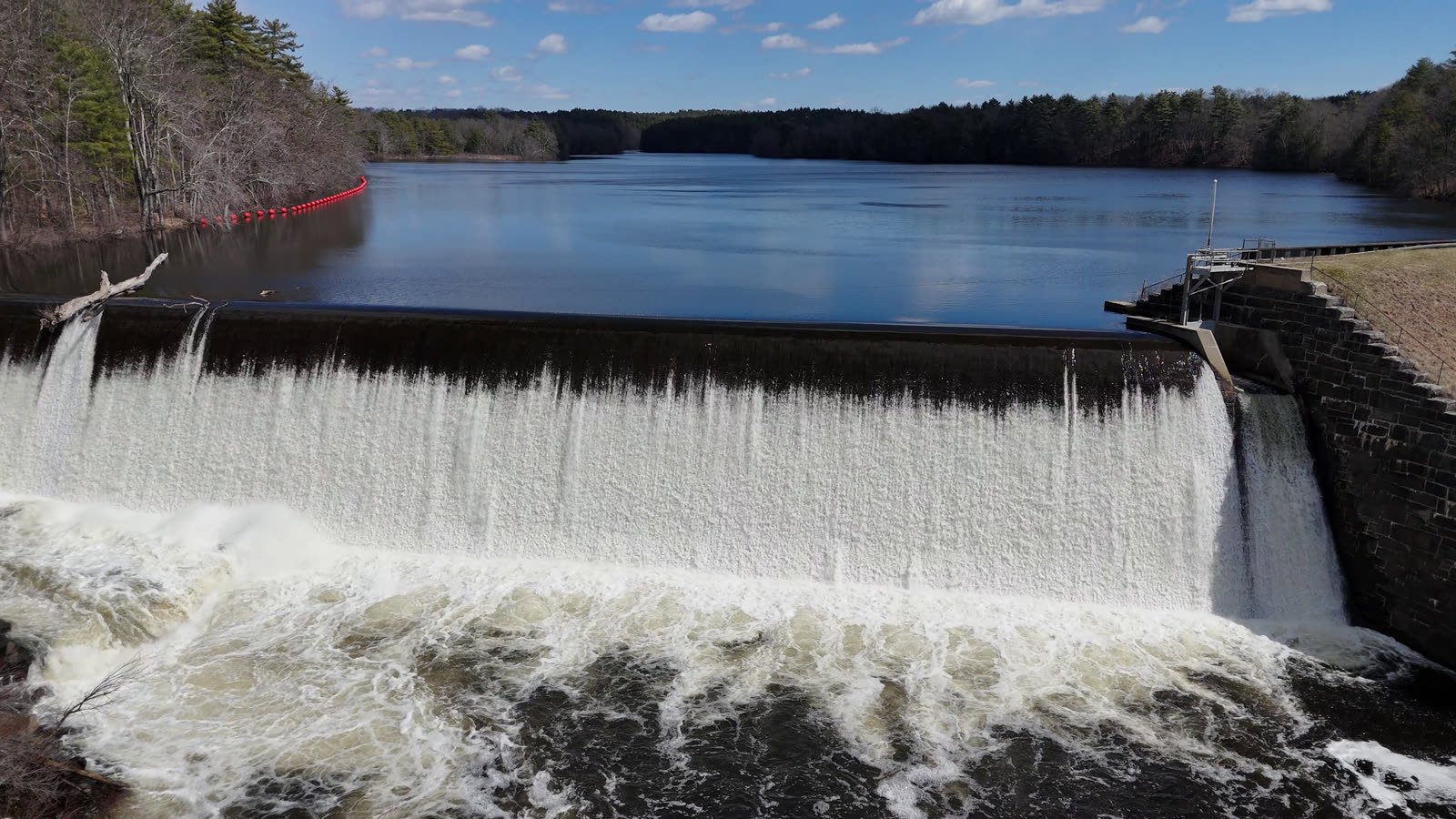 Dam spillway and reservoir from above